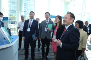 The guests of honour visit the exhibition booths of CUHK's robotic innovations.