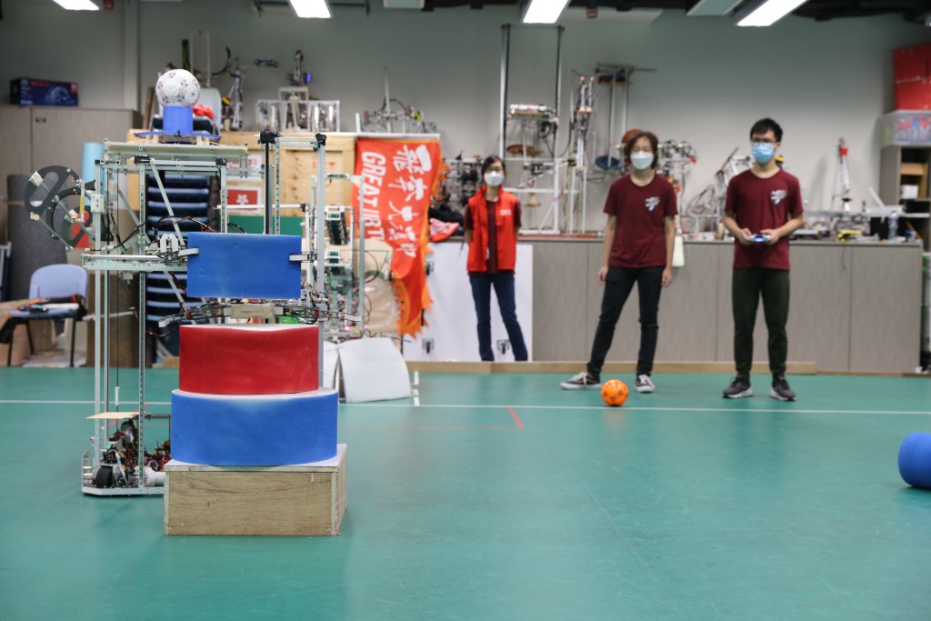 The team implements new technologies to increase the speed and maneuverability of their robots, including a new 360-degree rotation wheel system and a dual gripper shown in this picture.